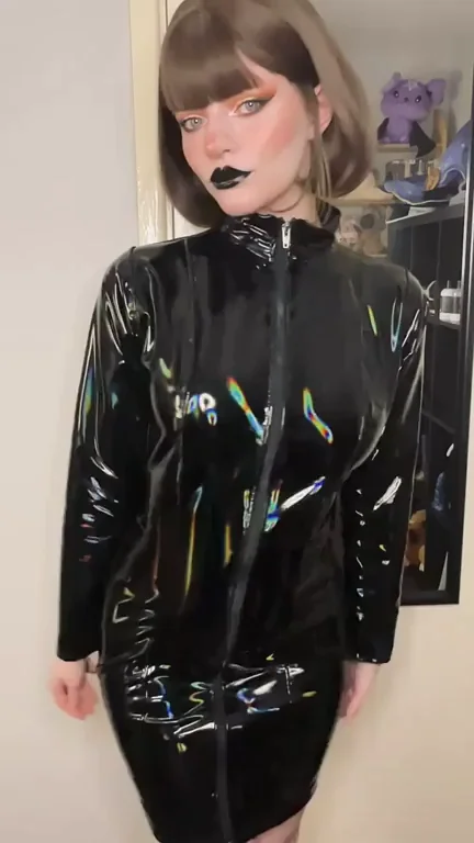 My lips are as shiny as my holographic PVC dress ðŸ–¤