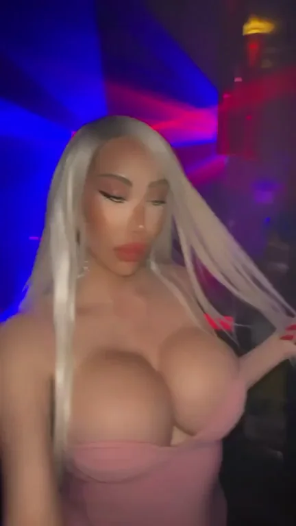 Bimbo Bombshell's Massive Tits Too Hot for Club Lights