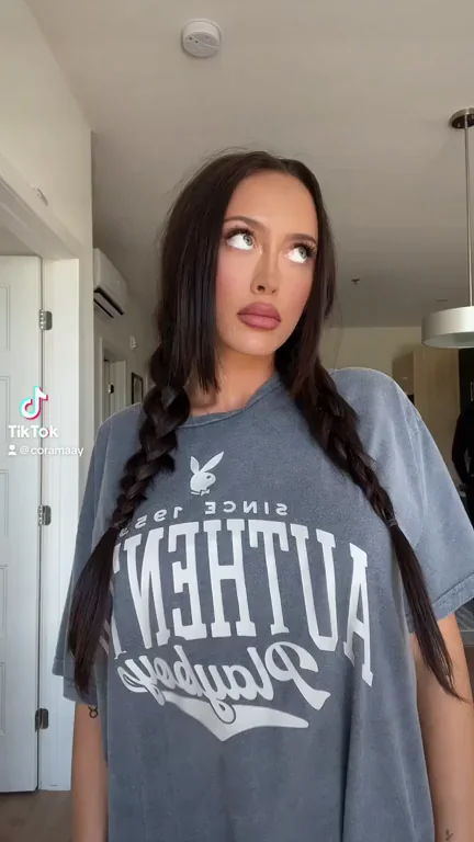 TikTok Slut's Massive Fake Tits Bounce in Playboy Tee Tease