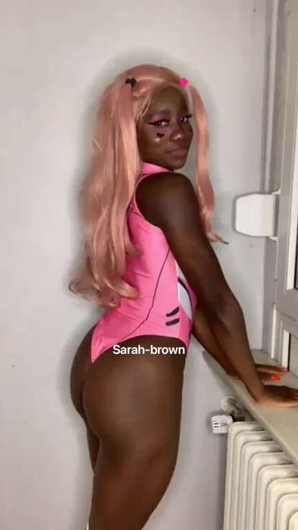 Ebony Cosplay Slut in Pink Thong Leotard Gets Gripped by White Dude's Hands