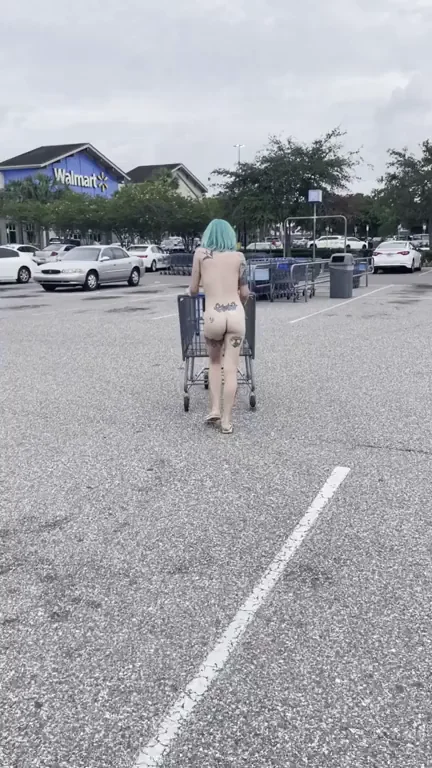 Naked Neon Slut Dumps Trash in Public Lot!