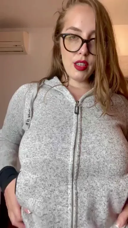 Peek-a-Boo Tits: Glasses Chick Flashes Massive Jugs in Hoodie Tease