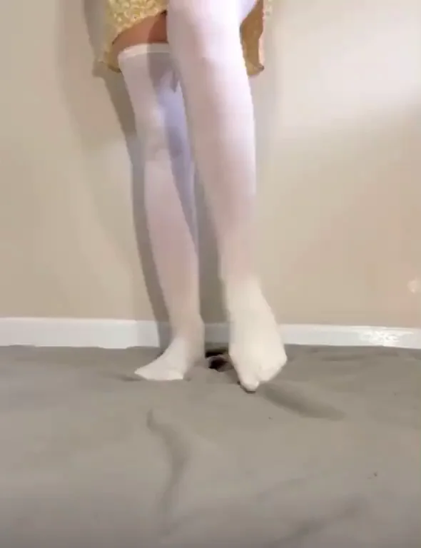Tiny Tease Lifts Dress to Flash Juicy Ass in Thigh Highs
