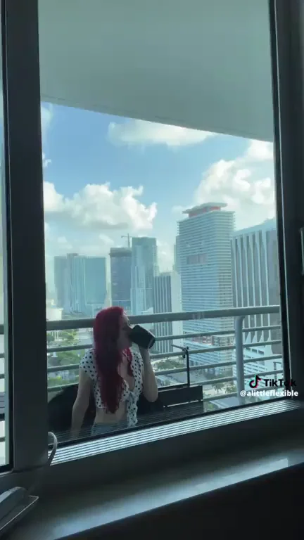 Redhead Slut Flashes Tits on Balcony with City View