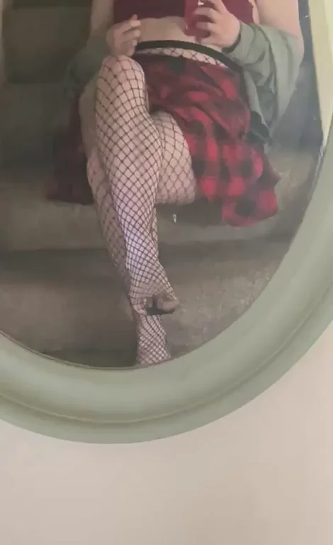 Shh, Secret Peek at My Fishnet Tights and Plaid Skirt Tease