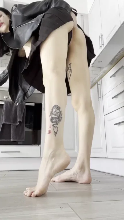 Squatting Slut Teases Her Tight Pussy in Leather Skirt