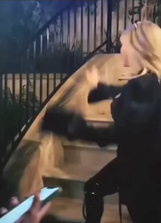 Billie Eilish swinging the puppies