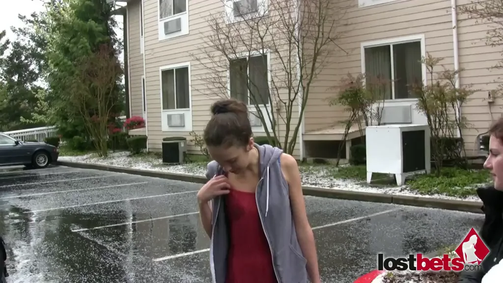 Julie, Lily, and Elizabeth dare each other to expose their breasts outside during a freak Seattle hailstorm