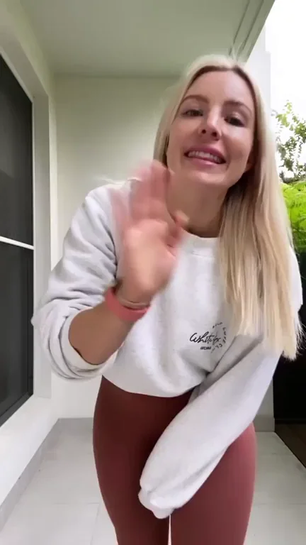Hiking up her yoga pants