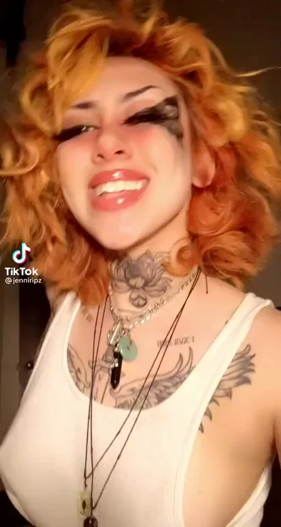 Fiery Redhead's Juicy Nipple Slip Tease