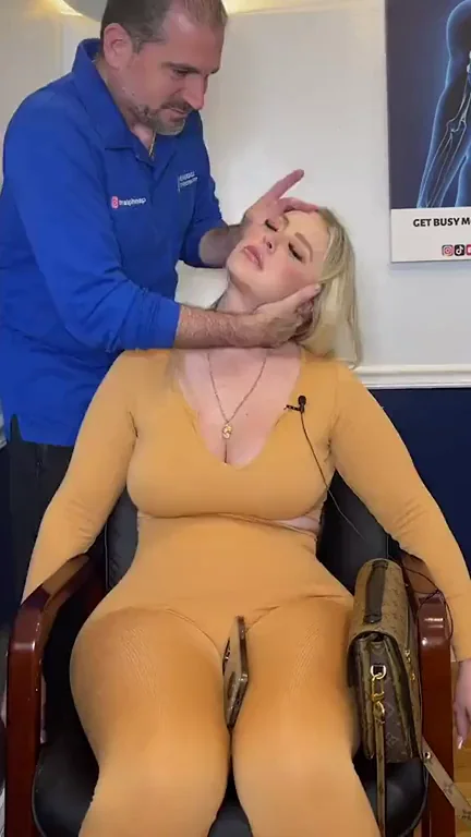 Blonde Bombshell's Bodysuit Massage: Big Tits Jiggle in Chiropractor Grip