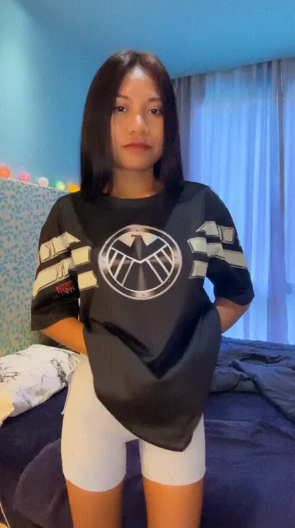 Cute Asian Teen Drops Oversized Shield Jersey for Tiny Titty Tease