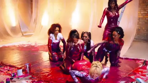 Girl on the floor has a an amazing fake butt