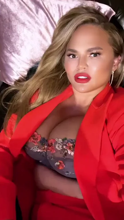 Chrissy Teigen showing them off