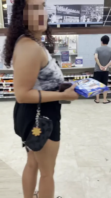 Checkout Tease: Busty Babe Flashes Massive Tits at Cash Register