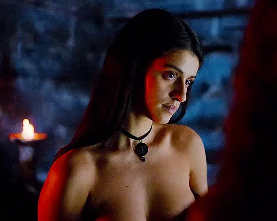 Anya Chalotra's Sultry Topless Tease in Candlelit Shadows