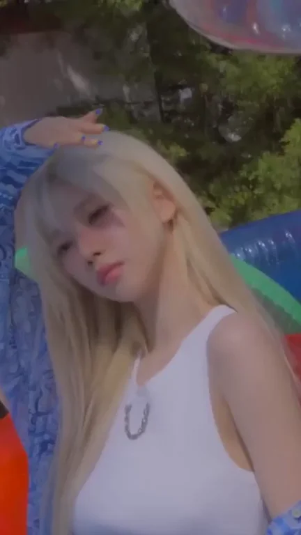 Karina's K-Pop Tease: Blonde Bombshell in Tight Tanks