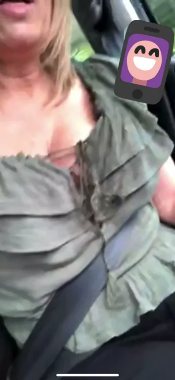 Milf adjusting tits in traffic on FaceTime