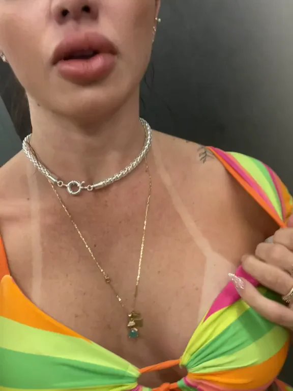 Tan Line Tease: MILF's Perky Big Tits Spill Out in Rainbow Bikini
