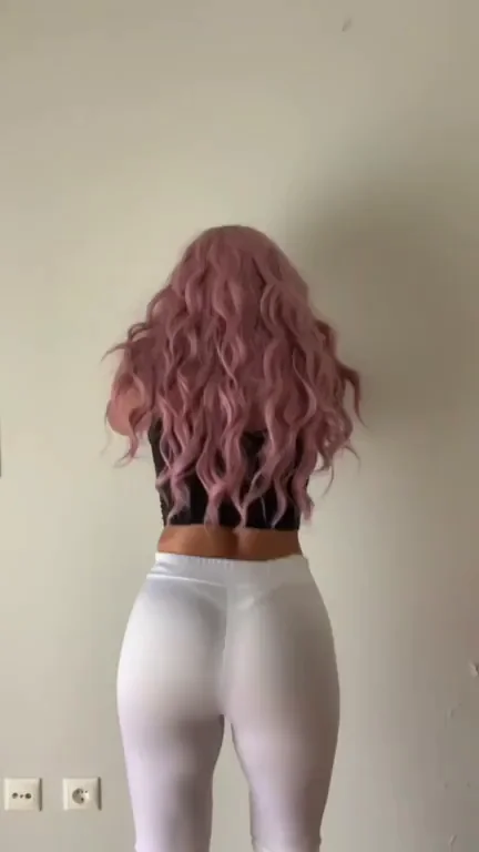 With my vibrant pink hair cascading down my seductive curves, I exuded an irresistible aura of passion and unleashed desires.