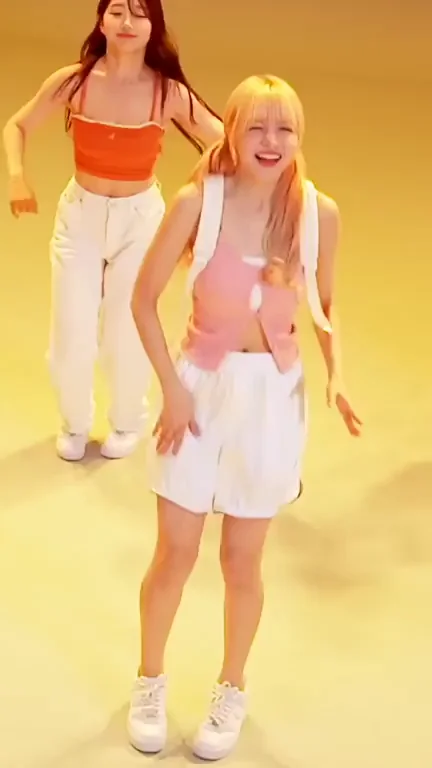 NMIXX Lily Teasing in Pink Crop Top and Tight Shorts