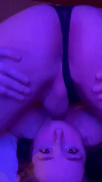 Upside-Down Sissy Slurps Thick Cock in Purple Glow