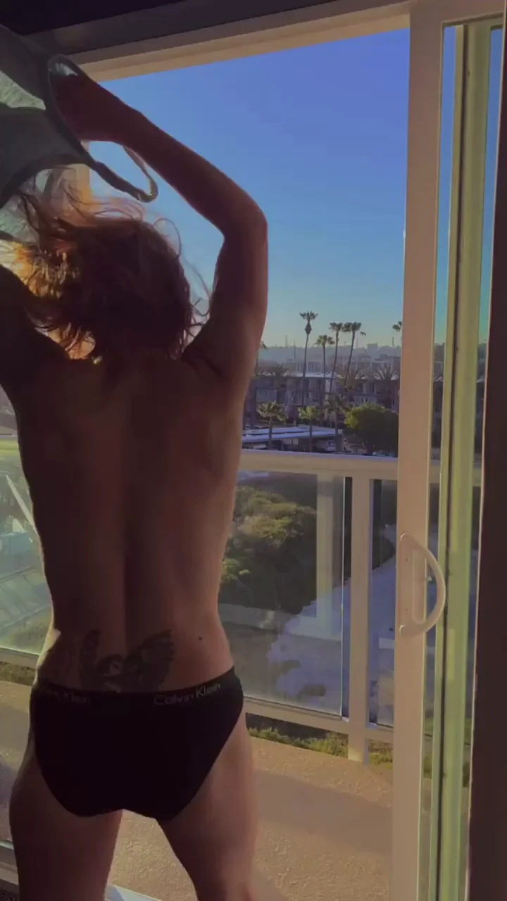 Staying in a hotel means you flash on the balcony in the morning. It's the rules. [GIF]