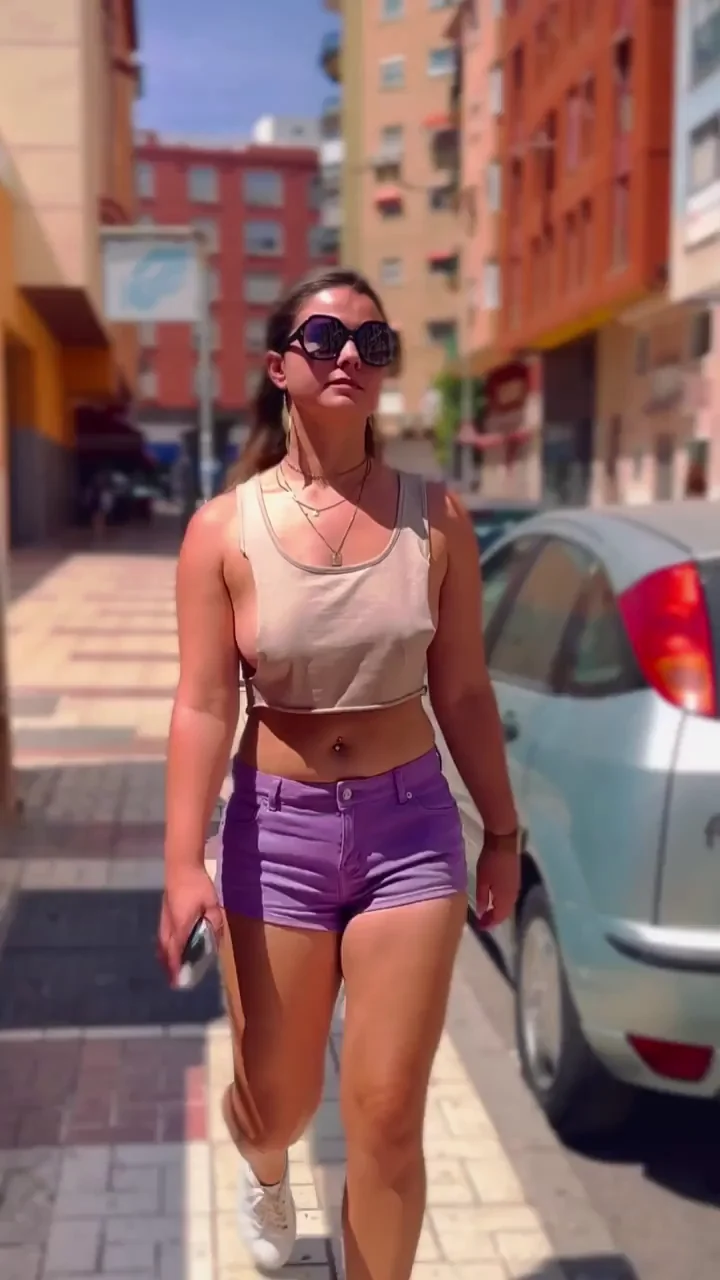 Braless in top too small to cover Tits walking in the street.