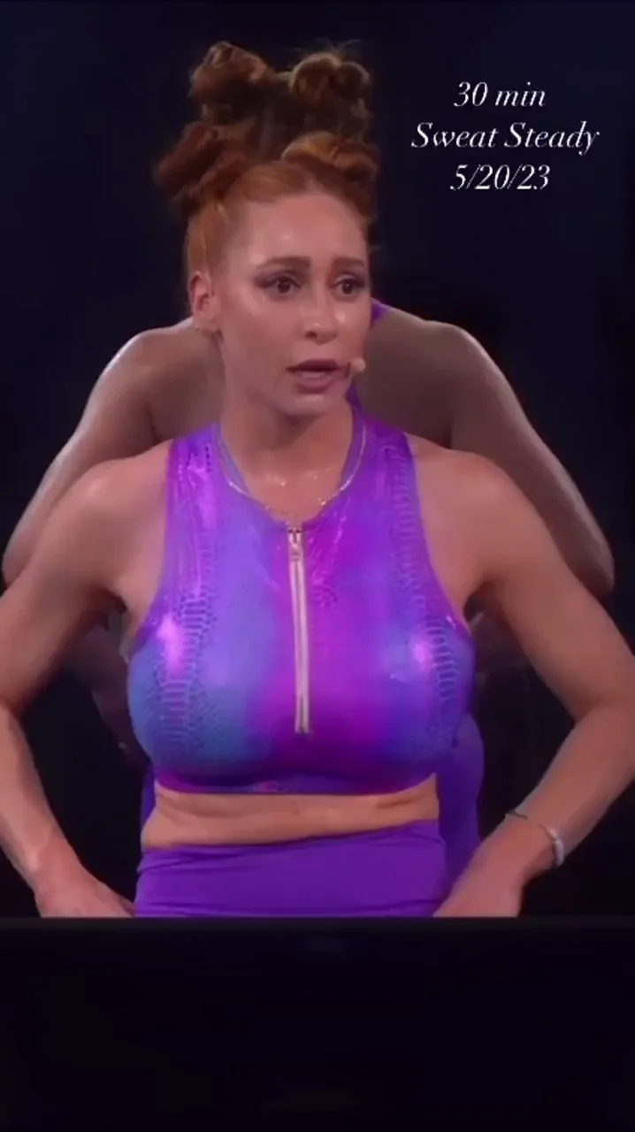 Busty Redhead Sweetie Rides Hard in Shiny Purple Gear