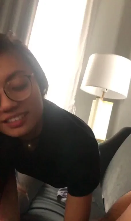 Glasses-Wearing Ebony Babe Devours Thick Cock in Hotel Slurp Fest