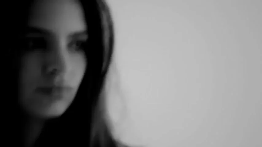 Emily Ratajkowski's Sultry Gaze in Black and White Tease